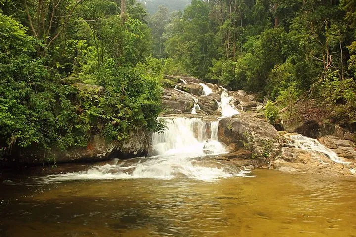Water dropping through the tiers of the Kanching rainforest waterfall into the pool below